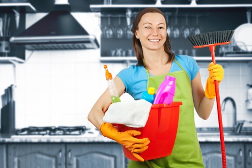 Carpet cleaning technician preparing equipment with safety in mind